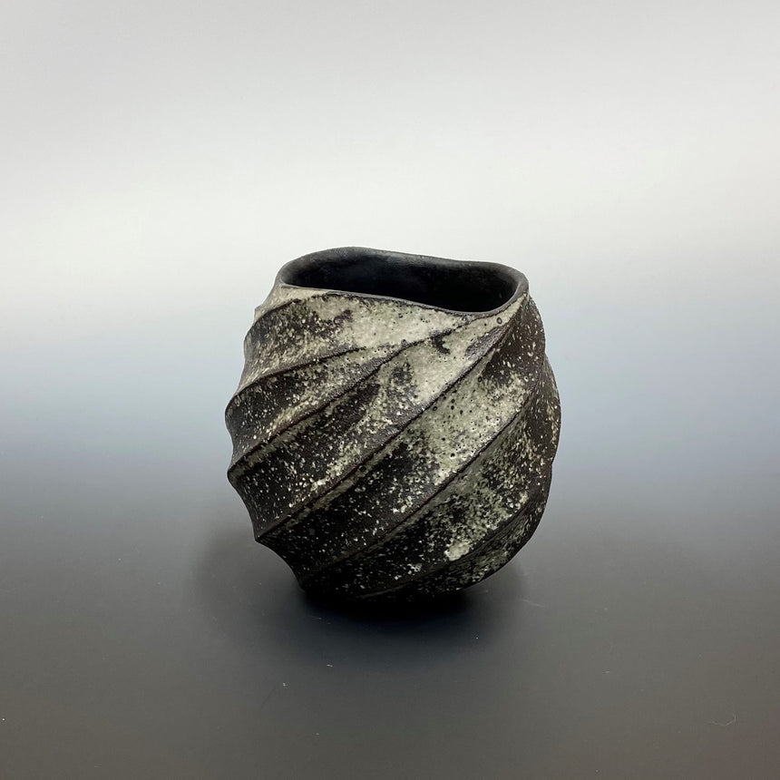 Carbonized twist lock cup